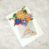 Quilled flowers in envelope greeting card