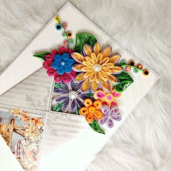 Quilled flowers in envelope greeting card