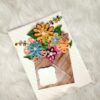 Quilled flowers in envelope greeting card