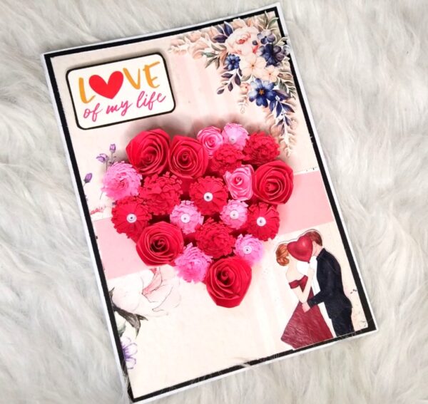 Quilled red flowers in heart greeting card