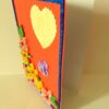 Beautiful Yellow And Pink Flowers On Red Greeting Card image