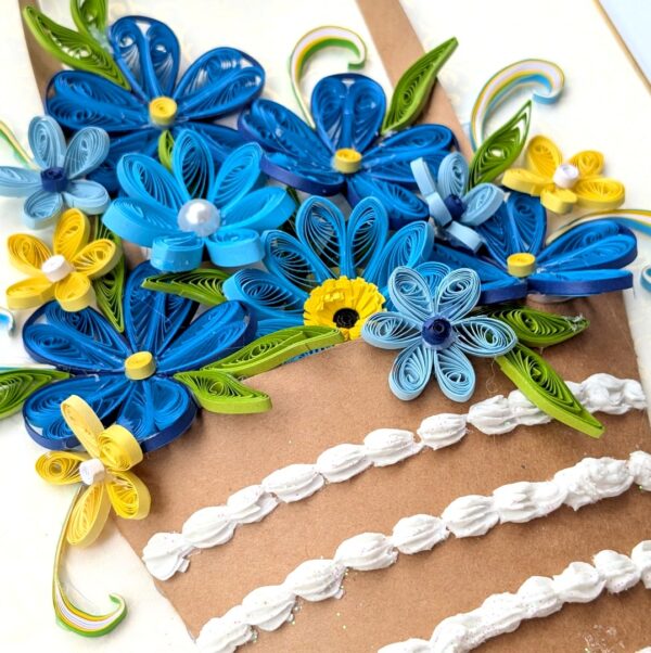 PXL_20260621_125305605 A4 size Blue Quilled Greeting Card