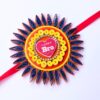 Quilled Rakhi - Yellow orange - Big size