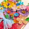 PXL_20260913_095402063 A4 Multicolored Quilled flowers in envelope greeting card